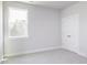 Bedroom featuring a large window for ample light and double door closet at 207 Golfview Ave, Benson, NC 27504