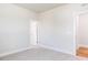 Bedroom with ensuite bath featuring plush carpet and neutral paint palette at 207 Golfview Ave, Benson, NC 27504