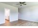 Bedroom view showcasing ensuite bathroom access and ceiling fan at 207 Golfview Ave, Benson, NC 27504