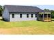 Back exterior view of home with siding, backyard and screened porch at 207 Golfview Ave, Benson, NC 27504