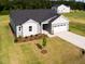 Stylish single-story home boasts gray siding, a two-car garage, and lush green landscaping at 207 Golfview Ave, Benson, NC 27504