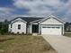 Charming single-story home with a well-manicured lawn and a two-car garage in a Gathering-friendly neighborhood at 207 Golfview Ave, Benson, NC 27504