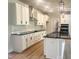 Modern kitchen featuring sleek countertops, stainless steel appliances, and a stylish island at 207 Golfview Ave, Benson, NC 27504