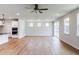 Spacious living room with laminate floors, recessed lighting, and sliding glass doors to the patio at 207 Golfview Ave, Benson, NC 27504