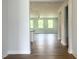 Bright living room with hardwood floors and large windows providing ample natural light at 207 Golfview Ave, Benson, NC 27504