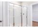 Shower with white tiling and glass door at 207 Golfview Ave, Benson, NC 27504