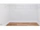 Walk-in closet with laminate flooring and metal shelving at 207 Golfview Ave, Benson, NC 27504