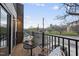 Cozy balcony with wrought iron railing features outdoor seating and a view of the city skyline at 208 Martin Luther King Jr Blvd, Raleigh, NC 27601
