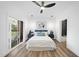 Bedroom features natural light, ceiling fan, modern furniture, and direct access to the balcony at 208 Martin Luther King Jr Blvd, Raleigh, NC 27601