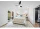 A bright bedroom features modern lighting, a ceiling fan, neutral tones, and sliding glass doors at 208 Martin Luther King Jr Blvd, Raleigh, NC 27601