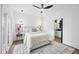 Bright bedroom with modern lighting, a ceiling fan, and an ensuite bathroom at 208 Martin Luther King Jr Blvd, Raleigh, NC 27601
