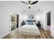 Bedroom features natural light, ceiling fan, modern furniture, and direct access to the balcony at 208 Martin Luther King Jr Blvd, Raleigh, NC 27601