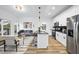 Bright open floor plan with kitchen island, stainless appliances, and living area at 208 Martin Luther King Jr Blvd, Raleigh, NC 27601