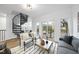 Living room with modern decor, spiral staircase, and balcony access at 208 Martin Luther King Jr Blvd, Raleigh, NC 27601
