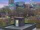 Rooftop patio with a small gray building overlooking the city skyline at dusk at 208 Martin Luther King Jr Blvd, Raleigh, NC 27601