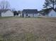View of the house from the large backyard, showcasing the spacious lawn area at 225 Sebastian Way, Rocky Mount, NC 27804
