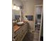 Bathroom featuring a vessel sink, wood countertop, and access to a separate toilet room at 225 Sebastian Way, Rocky Mount, NC 27804