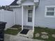 Exterior shot of the house highlighting the entrance with a white picket fence detail and stone pathway at 225 Sebastian Way, Rocky Mount, NC 27804