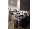 Well-lit kitchen featuring white cabinets, stainless steel appliances, and a functional breakfast bar at 225 Sebastian Way, Rocky Mount, NC 27804
