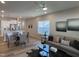 Open-concept living area with modern decor, a stylish dining area, and a bright, airy atmosphere at 228 Pecan Valley Way, Four Oaks, NC 27524