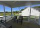 Relaxing screened porch with comfortable seating and serene views of the green outdoors at 228 Pecan Valley Way, Four Oaks, NC 27524