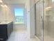 Bathroom with double vanity, shower, and tile flooring at 245 Golfview Ave, Benson, NC 27504