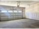 Spacious two-car garage with concrete floors and prepped walls at 245 Golfview Ave, Benson, NC 27504