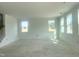 Spacious living room with bright white walls and abundant natural light from several windows, unfinished at 245 Golfview Ave, Benson, NC 27504