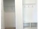 Mudroom with bench seating, storage cubbies, and coat hooks at 245 Golfview Ave, Benson, NC 27504
