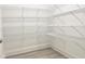 Walk-in pantry with white wire shelving for optimal storage and organization at 245 Golfview Ave, Benson, NC 27504