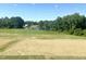 Scenic view of a lake and green landscape from a window at 245 Golfview Ave, Benson, NC 27504