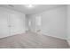 Spacious bedroom with plush carpet flooring, neutral walls, and an attached bathroom with dual sinks at 2915 Huxley Way, Apex, NC 27502