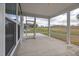 Covered patio with concrete flooring and views of the landscaped yard at 2915 Huxley Way, Apex, NC 27502
