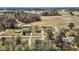Expansive aerial view of the neighborhood with large lots and mature trees near farmland at 3005 Lewy Ln, Rocky Mount, NC 27801