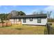 Single-story home with a wooden deck and fenced-in backyard, perfect for outdoor living at 3005 Lewy Ln, Rocky Mount, NC 27801