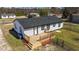 Single-story home with wooden deck and fenced-in yard, offering a private outdoor space at 3005 Lewy Ln, Rocky Mount, NC 27801