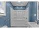 Updated bathroom featuring new bath and shower, vanity and mirror at 3005 Lewy Ln, Rocky Mount, NC 27801