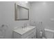 Bathroom vanity with a rectangular mirror, modern sink, and attractive countertops at 3005 Lewy Ln, Rocky Mount, NC 27801