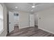 Neutral bedroom featuring updated flooring and two access doors with ensuite bath in the background at 3005 Lewy Ln, Rocky Mount, NC 27801