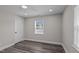 Clean, cozy bedroom featuring modern flooring and lots of natural light from the two windows at 3005 Lewy Ln, Rocky Mount, NC 27801