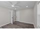 Neutral bedroom featuring updated flooring, modern ceiling fan and plenty of natural light at 3005 Lewy Ln, Rocky Mount, NC 27801
