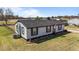 Charming one-story home with a well-manicured lawn, garden, and American flag displayed at 3005 Lewy Ln, Rocky Mount, NC 27801