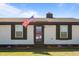 Inviting home with a well-manicured lawn and colorful flowerbeds accenting the entryway at 3005 Lewy Ln, Rocky Mount, NC 27801