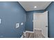 Well lit laundry room with blue walls and lots of plumbing hookups for appliances at 3005 Lewy Ln, Rocky Mount, NC 27801