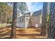 The backyard features white lattice trim and stone patio at 308 Burnt Pine Ct, Apex, NC 27502