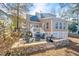 Inviting backyard patio features stone walls, seating, and outdoor grill, perfect for entertaining at 308 Burnt Pine Ct, Apex, NC 27502