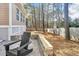 Back patio with stone details, perfect for relaxation and entertaining outdoors at 308 Burnt Pine Ct, Apex, NC 27502
