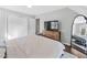 Bedroom showcasing a large window, light gray walls, and modern furnishings at 308 Burnt Pine Ct, Apex, NC 27502