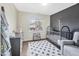 Stylish Bedroom with a dark crib, dresser, rug and bright window at 308 Burnt Pine Ct, Apex, NC 27502