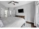 Bedroom featuring neutral walls, ceiling fan, and ample space for bedroom furniture at 308 Burnt Pine Ct, Apex, NC 27502